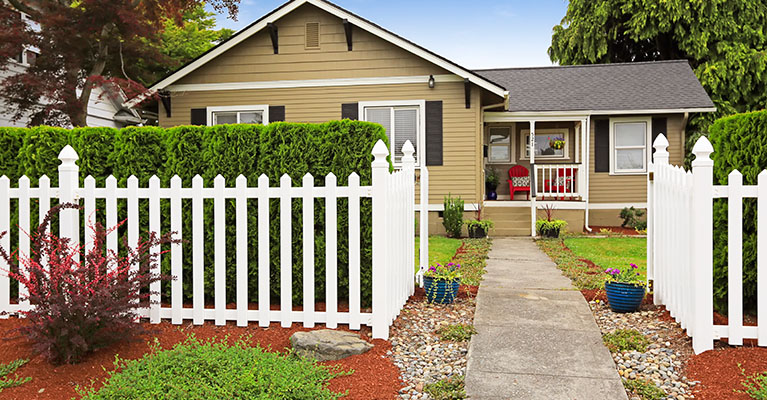 A white picket front yard fence