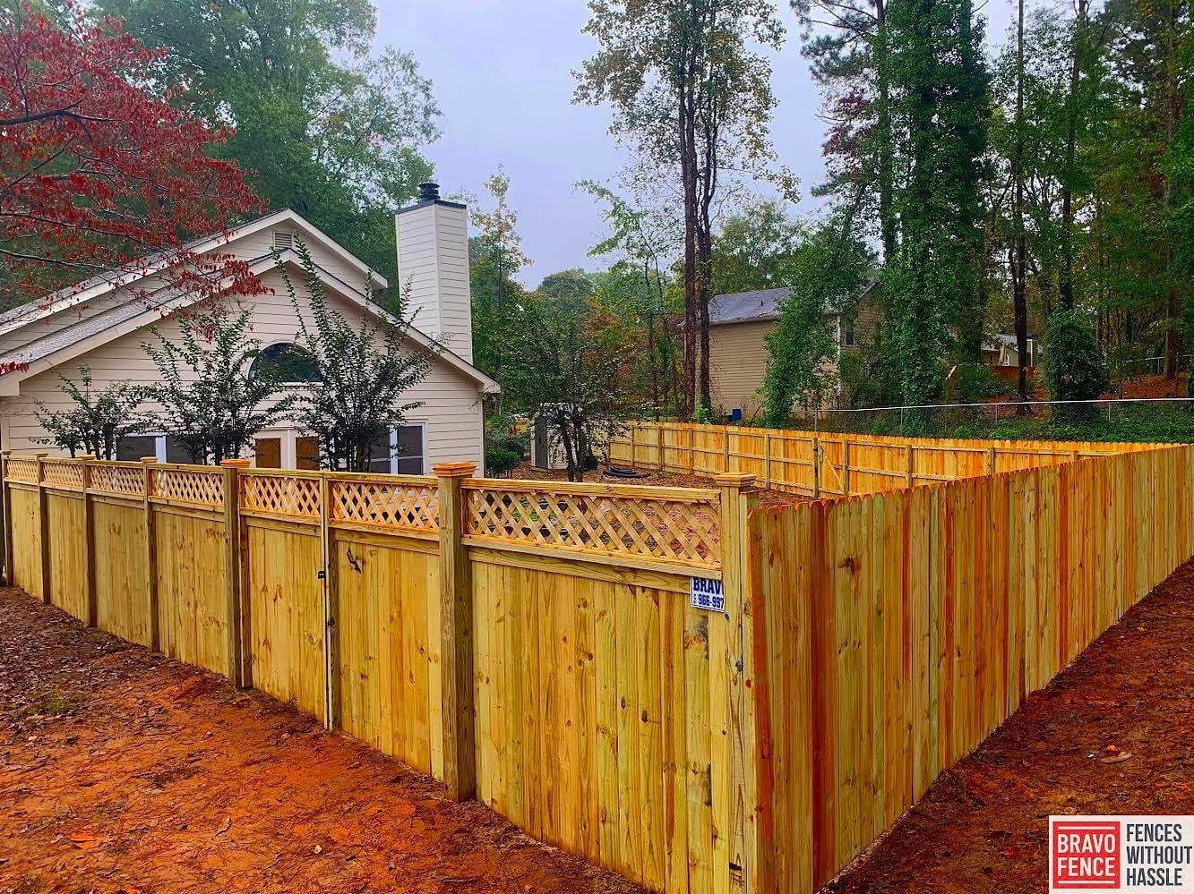 Large wood backyard fence with a natural stain finish