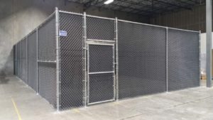 10’ security chainlink fence with privacy mesh. Interior of warehouse.