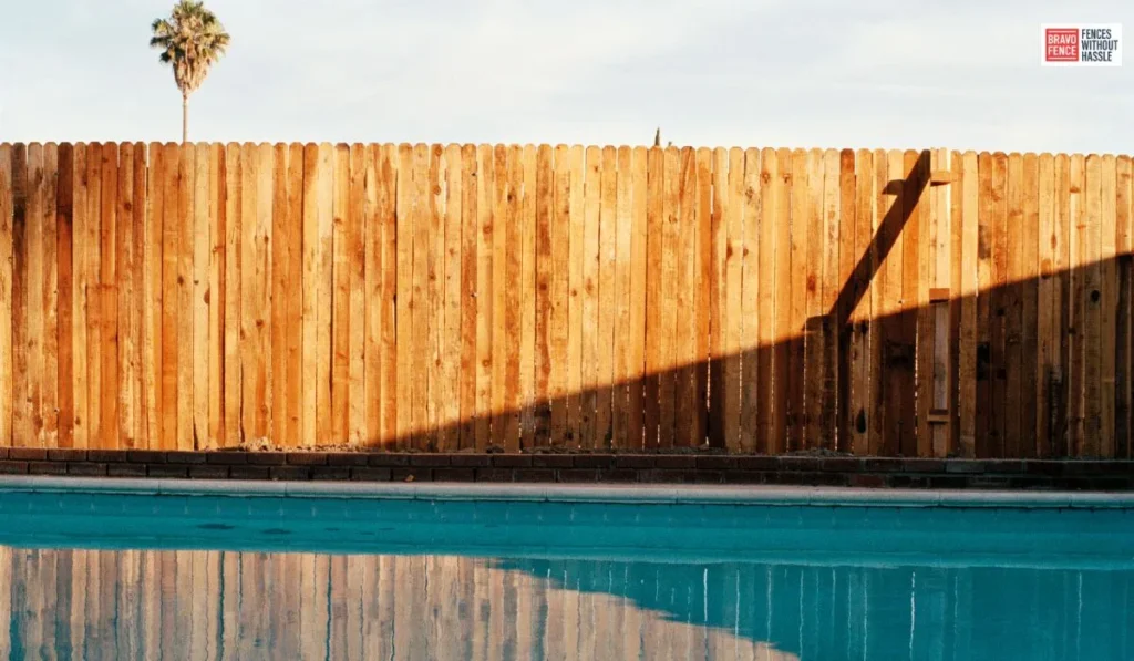 Wood fences bring timeless beauty and versatility to any pool area, offering a natural, rustic charm that complements a variety of outdoor styles. 