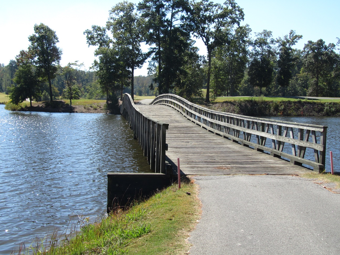 A wood bridge spanning Mirror Lake in Villa Rica, GA