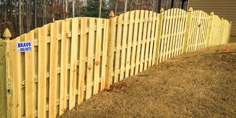 A cedar gothic post fence built by Bravo Fence