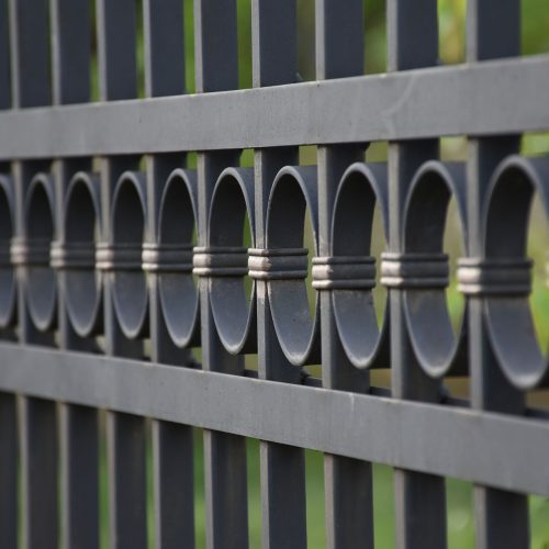 Close up of black aluminum fence